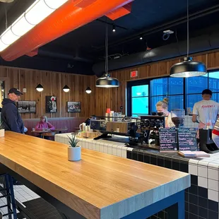 a man and a woman working in a restaurant
