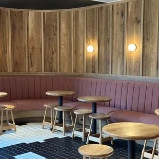Alcove seating area in front of coffee counter, by back entance
