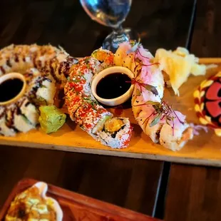 a platter of appetizers on a wooden table