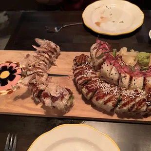 Sharing 3 rolls. I believe included are the godzilla, south american, and tako rolls.