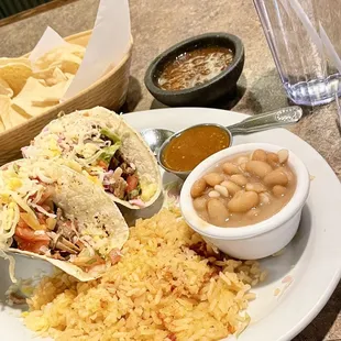 Lunch special of Soft Carnitas Tacos with pot beans &amp; rice for $12