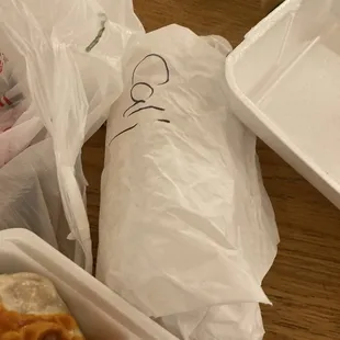 a sandwich in a styrofoam container
