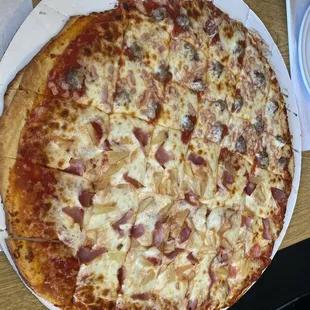 a pizza with cheese and ham