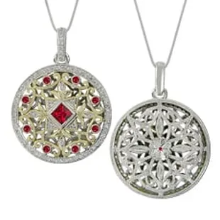 Stunning hand-carved design: two-tone gold cradling diamonds and rubies.