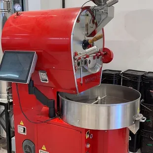 a red coffee roaster in a kitchen