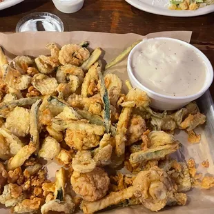 Sampler appetizer- fried mushrooms, zucchini, and pickles with ranch and gravy.