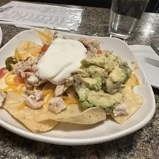 $12 plate of loaded nachos.  This was small. Suppose to have guacamole.