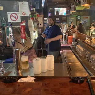 a bartender at the bar