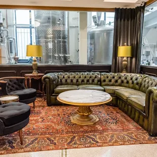 a living room with leather furniture