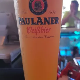 a glass of beer on a table