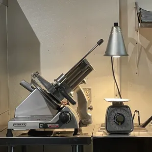 a meat grinder and a scale