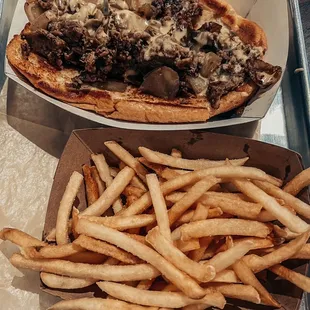 French Fries , grilled onions cheese sauce The Real Deal