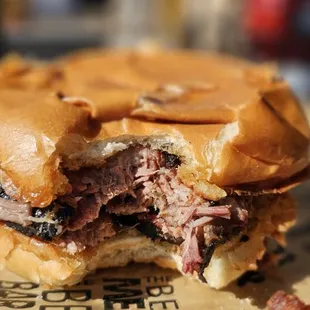 Brisket sandwich served on a brioche bun.