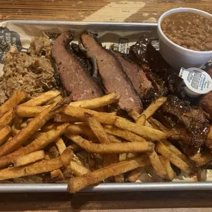 Pulled pork, brisket, ribs with bourbon beans and fries.