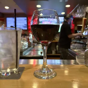 a glass of wine and a glass of ice