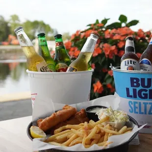 a bucket of beer and fries