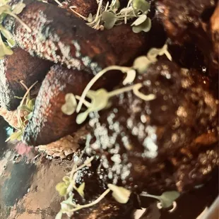 Oxtail stew, fried sweet plantain, and rice and peas.