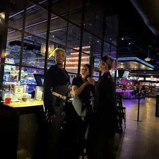 Staff hanging out instead of assisting with our table