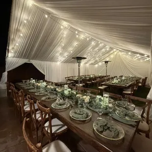 Rustic tables and cross backs 
Wedding setup