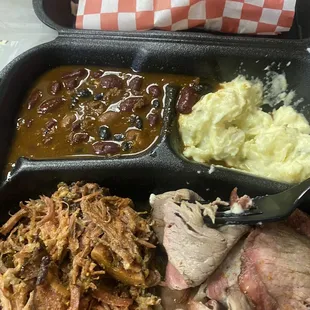 Pulled pork and tri tip. BBQ beans and potato salad. (I took a couple bites before I thought to snap the pic)