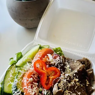 a meal in a styrofoam container