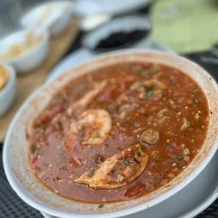 a bowl of soup with shrimp