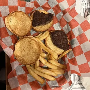 a basket of hamburgers and fries