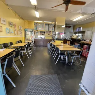 a classroom with tables and chairs