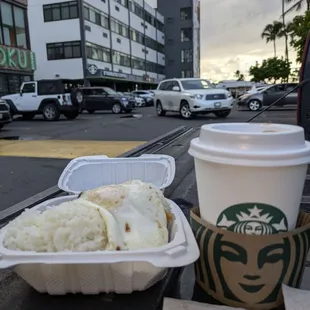 The Breakfast Bento excluding the Starbucks.$6.00 egg choice w/ choice of sausage or bacon served with two scoops white or fried rice.