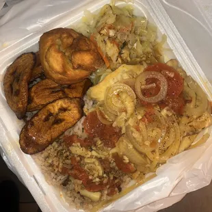 Steam tilapia with rice &amp; beans, plantains, cabbage&amp; carrots, and fried dumpling. SERIOUSLY DELICIOUS