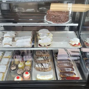 a display case filled with pastries