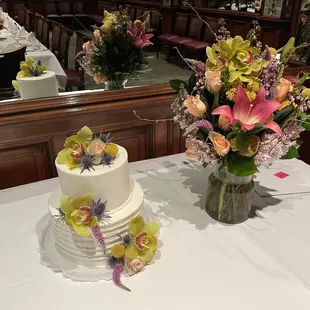 Chocolate layer cake filled with ganache, White layer cake filled with fresh strawberries.  Flowers from Sequoia Plaza Flowers.