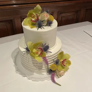 Delectable !  Chocolate layer cake filled with ganache, White layer cake filled with fresh strawberries.  Flowers : Sequoia Plaza Flowers