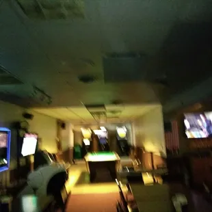 a man playing pool in a bar