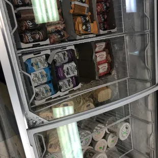 a refrigerator full of snacks and drinks