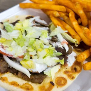 Gyro sandwich with our amazing fries that carry have a nice kick.