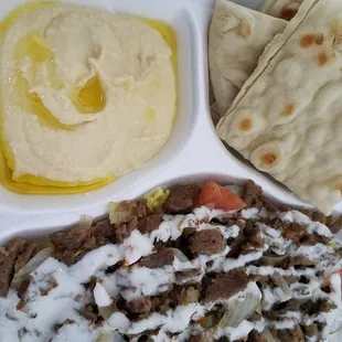 Our unique specialty the Gyro Blast.  Rice, Gyro meat, onions, and tomatoes served over a bed of yellow right...