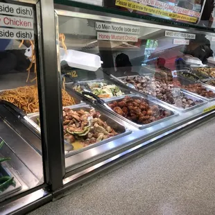 a variety of food items in a display case