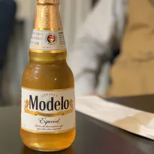 a modelo beer bottle on a table