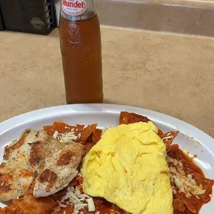 Red or green Chilaquiles , comes with two eggs any style, skirt steak or  grilled chicken.
