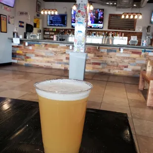 a glass of beer on a table