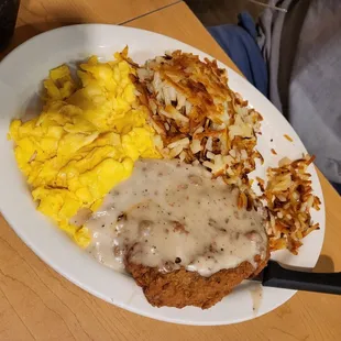 Country fried steak with scrambled eggs