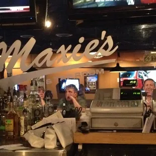 two men sitting at the bar