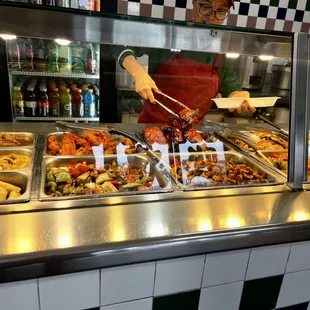 a person serving a variety of food