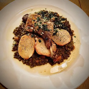 Confit De Canard:  Hudson Valley Duck leg confit, french green lentils &amp; skillet potatoes.