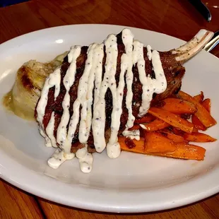 Homage to the Pig - Double-cut pork chop w Baby Cabbage &amp; Sausage Gratin w Candied bacon carrots and Lusty Monk&apos;s Mustard Creme. Great dish!