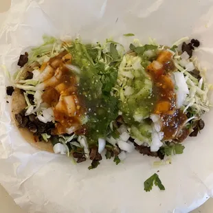 Carne Asada tacos decorated by me with added onions, salsa verde and salsa rojo