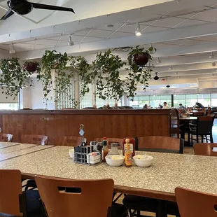 a dining room with a ceiling fan