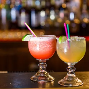 two cocktails on a bar