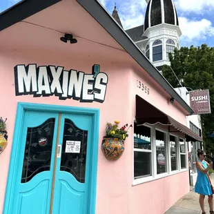 a woman standing in front of the building
